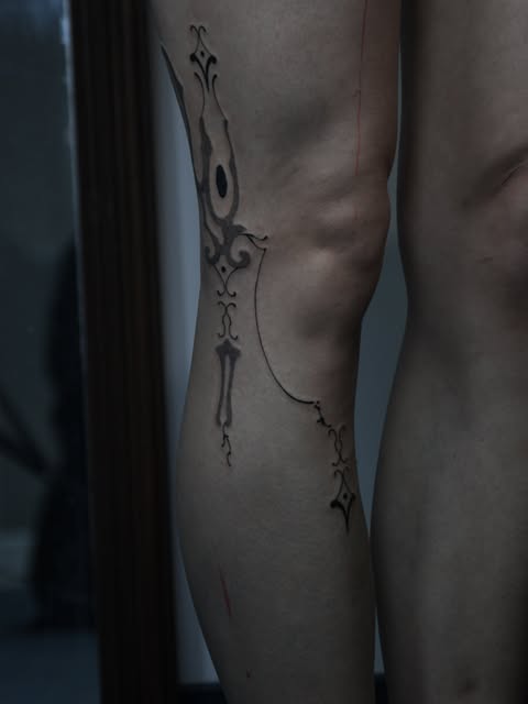 Ornamental leg tattoo by Zuzana Mala